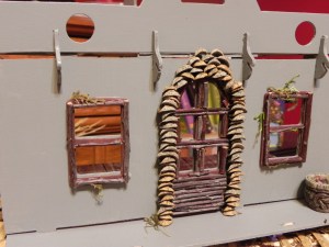 The ground floor, with a twig and pine cone shingled entranceway... 